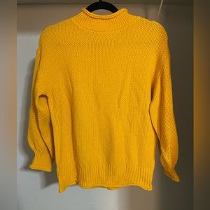 Tag-less golden sweater